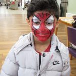 A little boy with spider-man face paint